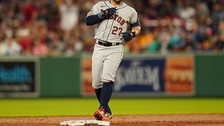 Aug 28, 2023; Boston, Massachusetts, USA; Houston Astros second baseman Jose Altuve (27) hits a double against the Boston Red Sox in the third inning at Fenway Park. Mandatory Credit: David Butler II-USA TODAY Sports