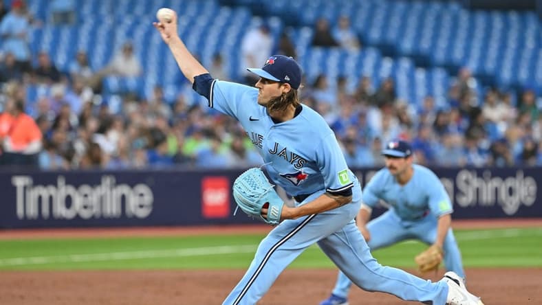 Aug 28, 2023; Toronto, Ontario, CAN;  Toronto Blue Jays starting pitcher Kevin Gausman (34) delivers a pitch against the Washington National in the second inning at Rogers Centre. Mandatory Credit: Dan Hamilton-USA TODAY Sports