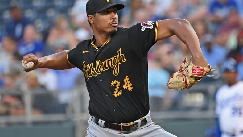 Aug 28, 2023; Kansas City, Missouri, USA;  Pittsburgh Pirates starting pitcher Johan Oviedo (24) delivers a pitch in the first inning against the Kansas City Royals at Kauffman Stadium. Mandatory Credit: Peter Aiken-USA TODAY Sports