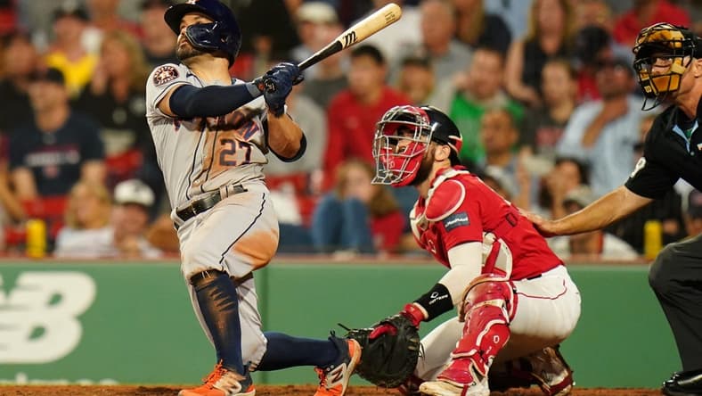 Aug 28, 2023; Boston, Massachusetts, USA; Houston Astros second baseman Jose Altuve (27) hits a two run home run against the Boston Red Sox in the eighth inning at Fenway Park. Mandatory Credit: David Butler II-USA TODAY Sports