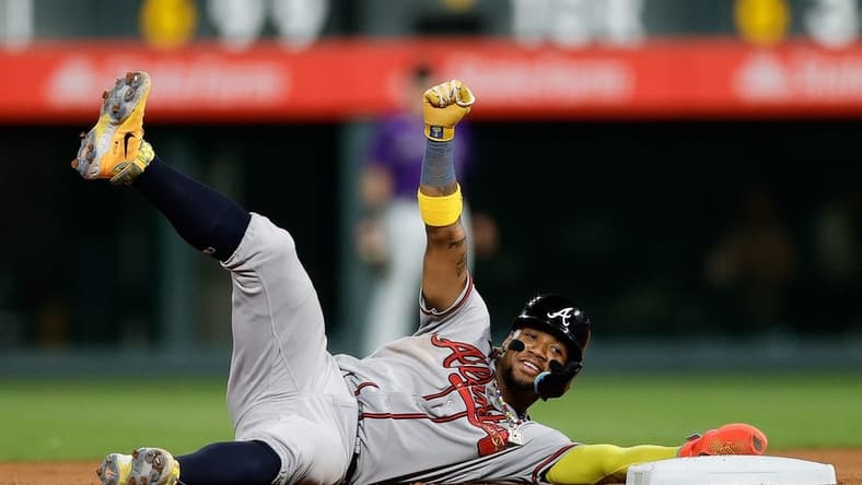 Aug 28, 2023; Denver, Colorado, USA; Atlanta Braves right fielder Ronald Acuna Jr. (13) reacts after stealing second in the seventh inning against the Colorado Rockies at Coors Field. Mandatory Credit: Isaiah J. Downing-USA TODAY Sports