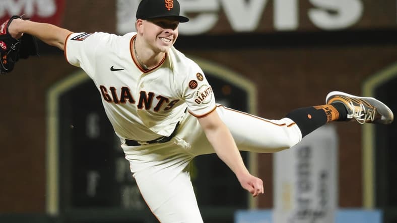 Aug 28, 2023; San Francisco, California, USA; San Francisco Giants starting pitcher Kyle Harrison (45) pitches the ball against the Cincinnati Reds during the seventh inning at Oracle Park. Mandatory Credit: Kelley L Cox-USA TODAY Sports