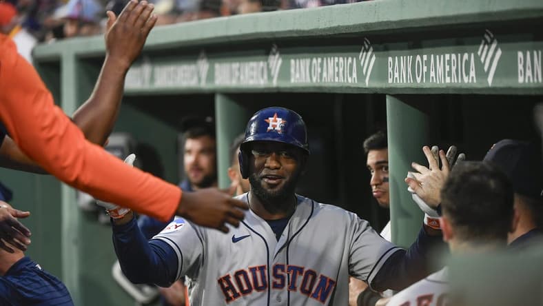Aug 29, 2023; Boston, Massachusetts, USA;  Houston Astros designated hitter Yordan Alvarez (44) is congratulated in the dugout after hitting a home run during the first inning against the Boston Red Sox at Fenway Park. Mandatory Credit: Bob DeChiara-USA TODAY Sports