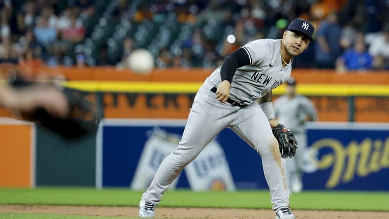 Aug 29, 2023; Detroit, Michigan, USA; New York Yankees shortstop Anthony Volpe (11) makes a throw to first to complete a double play in the seventh inning at Comerica Park. Mandatory Credit: Rick Osentoski-USA TODAY Sports