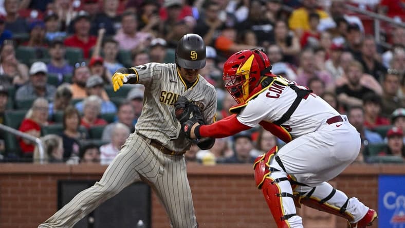 Aug 29, 2023; St. Louis, Missouri, USA;  St. Louis Cardinals catcher Willson Contreras (40) tags out San Diego Padres left fielder Juan Soto (22) during the third inning at Busch Stadium. Mandatory Credit: Jeff Curry-USA TODAY Sports
