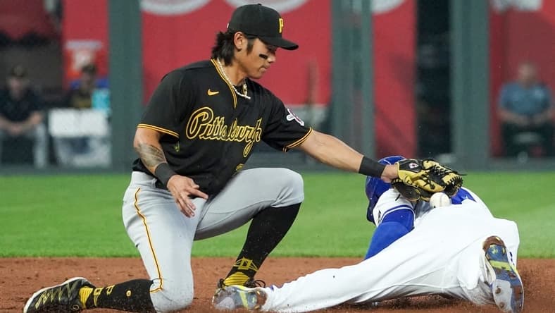 Aug 29, 2023; Kansas City, Missouri, USA; Kansas City Royals left fielder Dairon Blanco (44) steals second base as Pittsburgh Pirates second baseman Ji Hwan Bae (3) misses the tag in the third inning at Kauffman Stadium. Mandatory Credit: Denny Medley-USA TODAY Sports