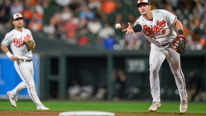 Aug 29, 2023; Baltimore, Maryland, USA; Baltimore Orioles first baseman Ryan Mountcastle (6) tosses the ball to Baltimore Orioles starting pitcher Dean Kremer (not shown) against the Chicago White Sox during the fifth inning at Oriole Park at Camden Yards. Mandatory Credit: Reggie Hildred-USA TODAY Sports