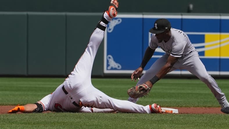 Aug 30, 2023; Baltimore, Maryland, USA; Baltimore Orioles outfielder Anthony Santander (25) slides in safely after connecting on a run scoring double in the first inning against the Chicago White Sox at Oriole Park at Camden Yards. Mandatory Credit: Mitch Stringer-USA TODAY Sports
