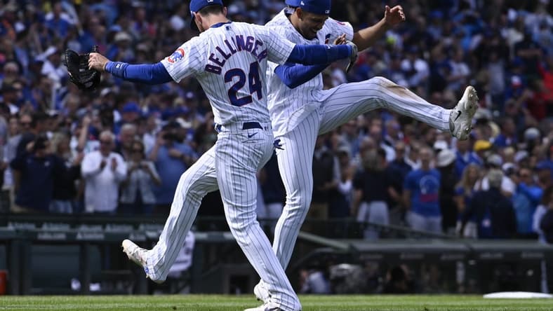 Aug 30, 2023; Chicago, Illinois, USA; Chicago Cubs center fielder Cody Bellinger (24) and second baseman Christopher Morel (5) celebrate  after beating the Milwaukee Brewers at Wrigley Field. Mandatory Credit: Matt Marton-USA TODAY Sports