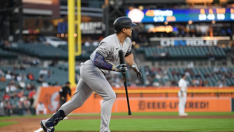 Aug 30, 2023; Detroit, Michigan, USA; New York Yankees designated hitter Giancarlo Stanton (27) watches his ball fly over the right center field wall for a home run against the Detroit Tigers in the fourth inning at Comerica Park. Mandatory Credit: Lon Horwedel-USA TODAY Sports