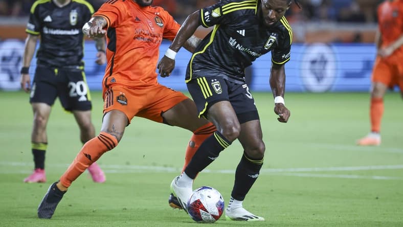 Aug 30, 2023; Houston, Texas, USA; Houston Dynamo FC midfielder Artur (6) and Columbus Crew SC defender Steven Moreira (31) battle for the ball during the first half at Shell Energy Stadium. Mandatory Credit: Troy Taormina-USA TODAY Sports