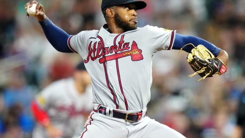 Aug 30, 2023; Denver, Colorado, USA; Atlanta Braves starting pitcher Darius Vines (64) delivers a pitch in the fourth inning against the Colorado Rockies at Coors Field. Mandatory Credit: Ron Chenoy-USA TODAY Sports