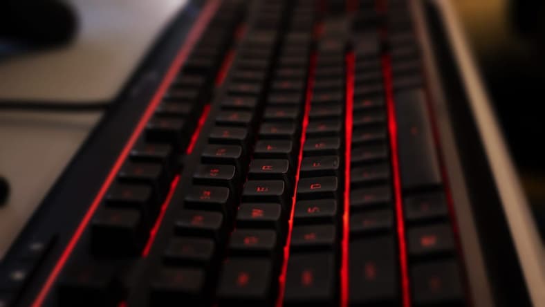 A custom gaming keyboard backlit with red LED lights waits for tactile input before Manual took on Boone County in a Rocket League match, which was streamed on YouTube on Thursday, March 5, 2020.