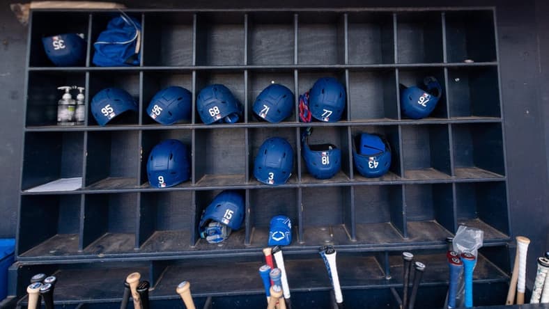 Mar 19, 2022; Peoria, Arizona, USA; A general view of hats and bats belonging the the Los Angeles Dodgers before spring training game against the Seattle Mariners at Peoria Sports Complex. Mandatory Credit: Allan Henry-USA TODAY Sports