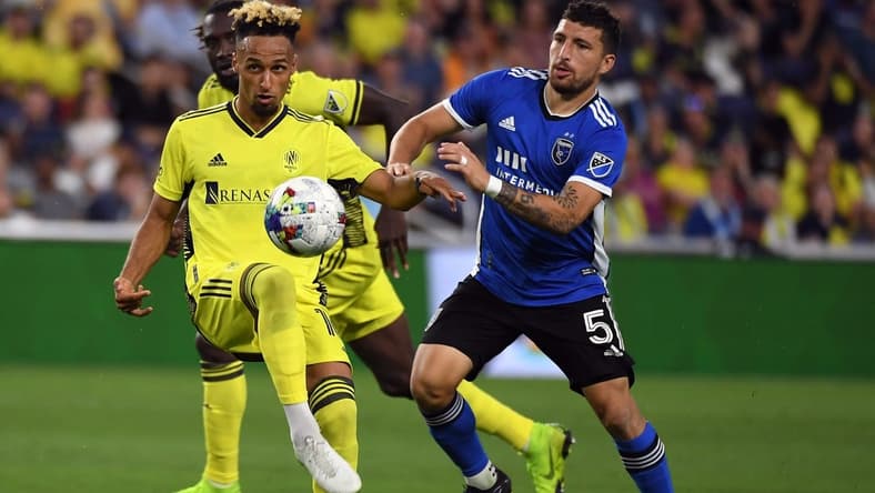 Jun 11, 2022; Nashville, Tennessee, USA; Nashville SC midfielder Hany Mukhtar (10) plays the ball into the box during the second half against the San Jose Earthquakes at Geodis Park. Mandatory Credit: Christopher Hanewinckel-USA TODAY Sports