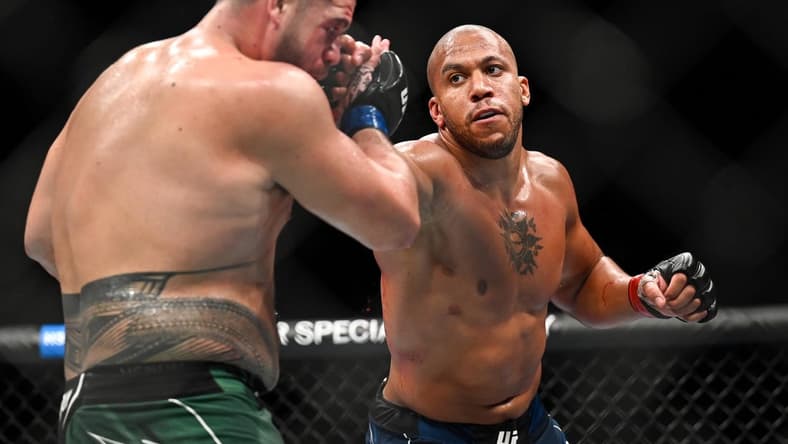 Sep 3, 2022; Paris, FRANCE; Ciryl Gane (red gloves) and Tai Tuivasa (blue gloves) during UFC Fight Night at Accor Arena. Mandatory Credit: Per Haljestam-USA TODAY Sports