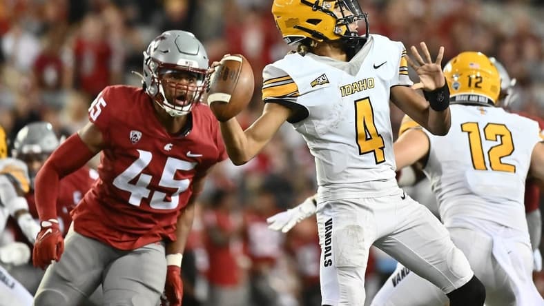 Sep 3, 2022; Pullman, Washington, USA; Idaho Vandals quarterback Gevani McCoy (4) throws the ball against Washington State Cougars defensive end Raam Stevenson (45) in the second half at Gesa Field at Martin Stadium. Mandatory Credit: James Snook-USA TODAY Sports