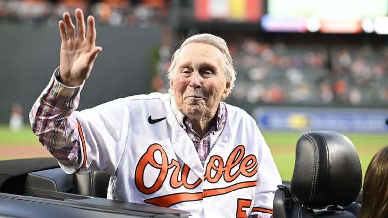 Sep 24, 2022; Baltimore, Maryland, USA; Hall of Fame member and former Baltimore Orioles player Brooks Robinson waves to the crowd prior to a game between the Orioles and the Houston Astros  at Oriole Park at Camden Yards. Mandatory Credit: James A. Pittman-USA TODAY Sports
