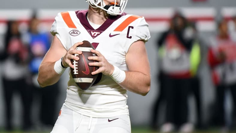 Oct 27, 2022; Raleigh, North Carolina, USA; Virginia Tech Hokies quarterback Grant Wells (6) drops back to pass during the first half against the North Carolina State Wolfpack at Carter-Finley Stadium. Mandatory Credit: Rob Kinnan-USA TODAY Sports