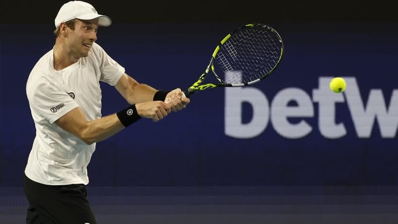 Mar 26, 2023; Miami, Florida, US; Botic van de Zandschulp (NED) hits a backhand against Casper Ruud (NOR) (not pictured) on day seven of the Miami Open at Hard Rock Stadium. Mandatory Credit: Geoff Burke-USA TODAY Sports