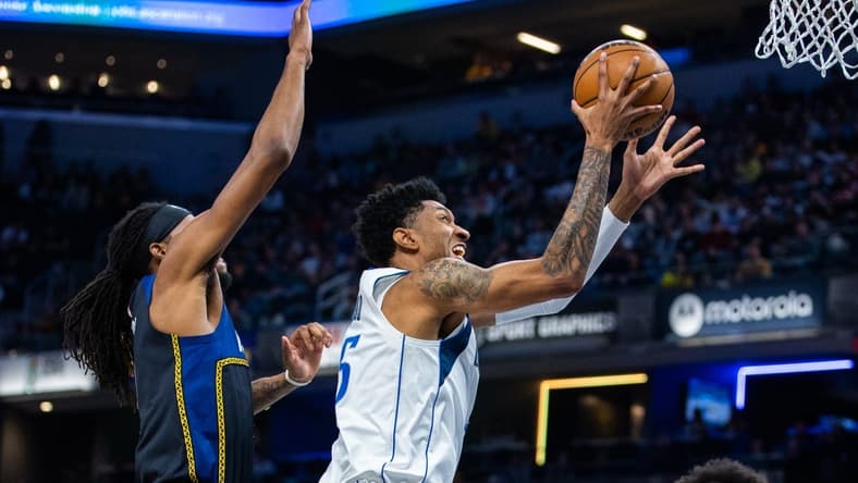 Mar 27, 2023; Indianapolis, Indiana, USA; Dallas Mavericks forward Christian Wood (35) shoots the ball while Indiana Pacers forward Isaiah Jackson (22) defends in the first quarter at Gainbridge Fieldhouse. Mandatory Credit: Trevor Ruszkowski-USA TODAY Sports