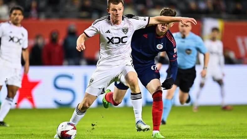Apr 1, 2023; Chicago, Illinois, USA; DC United midfielder Chris Durkin (8) controls the ball against the Chicago Fire FC at Soldier Field. Mandatory Credit: Jamie Sabau-USA TODAY Sports