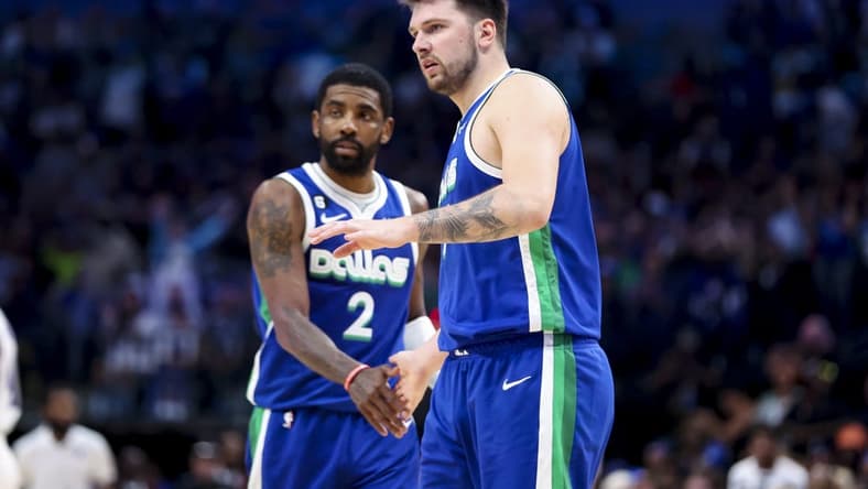 Apr 5, 2023; Dallas, Texas, USA; Dallas Mavericks guard Luka Doncic (77) and Dallas Mavericks guard Kyrie Irving (2) react during the fourth quarter against the Sacramento Kings at American Airlines Center. Mandatory Credit: Kevin Jairaj-USA TODAY Sports