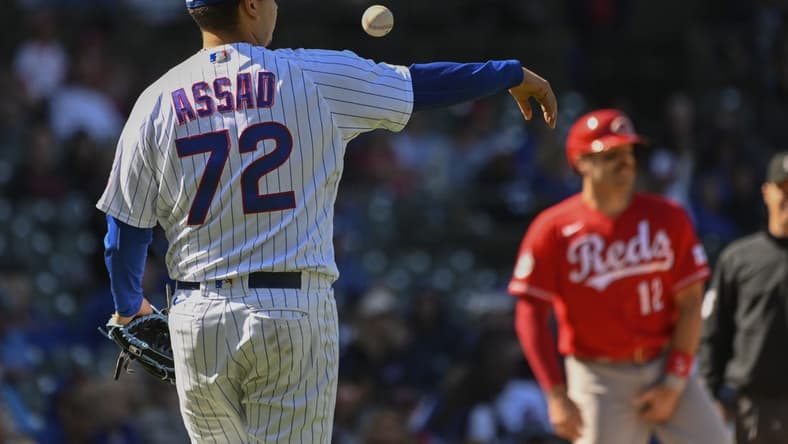 May 26, 2023; Chicago, Illinois, USA; Chicago Cubs starting pitcher Javier Assad (72) bumps the ball during the ninth inning against the Cincinnati Reds at Wrigley Field. Mandatory Credit: Matt Marton-USA TODAY Sports