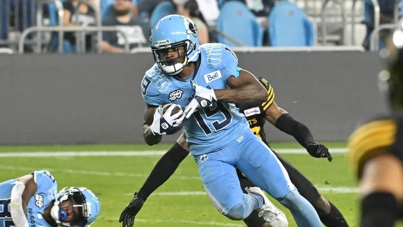 Jun 18, 2023; Toronto, Ontario, CAN; Toronto Argonauts wide receiver Kurleigh Gittens Jr. (19) runs with the ball after catching a pass against the Hamilton Tiger-Cats in the fourth quarter at BMO Field. Mandatory Credit: Dan Hamilton-USA TODAY Sports