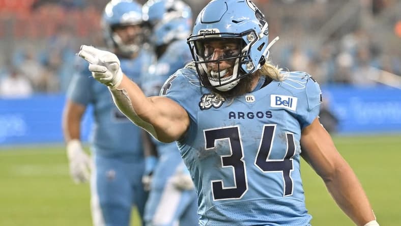 Jun 18, 2023; Toronto, Ontario, CAN; Toronto Argonauts running back AJ Ouellette (34) gestures after running for a first down against the Hamilton Tiger-Cats in the fourth quarter at BMO Field. Mandatory Credit: Dan Hamilton-USA TODAY Sports
