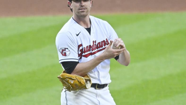 Jul 4, 2023; Cleveland, Ohio, USA; Cleveland Guardians starting pitcher Shane Bieber (57) reacts after giving up a home run in the fifth inning against the Atlanta Braves at Progressive Field. Mandatory Credit: David Richard-USA TODAY Sports