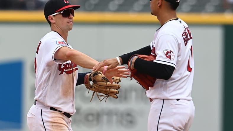Jul 26, 2023; Cleveland, Ohio, USA; Cleveland Guardians right fielder Will Brennan (17) and second baseman Andres Gimenez (0) celebrate after the Guardians beat the Kansas City Royals at Progressive Field. Mandatory Credit: Ken Blaze-USA TODAY Sports