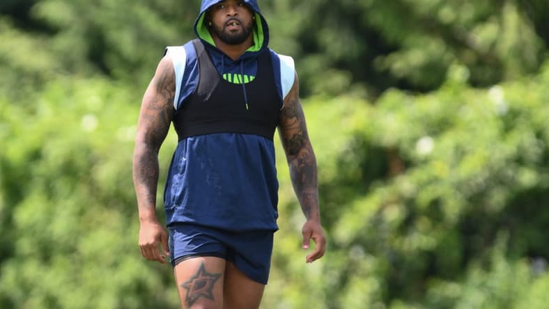 Jul 30, 2023; Renton, WA, USA; Seattle Seahawks safety Jamal Adams (33) warms up prior to training camp at Virginia Mason Athletic Center. Mandatory Credit: Steven Bisig-USA TODAY Sports