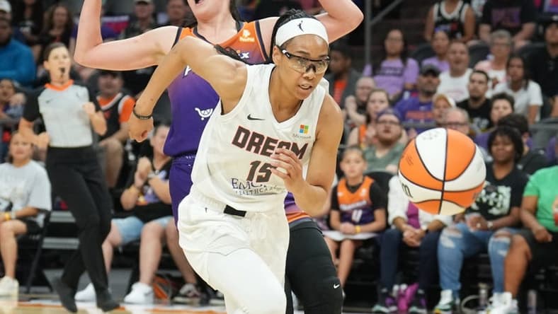 Aug 3, 2023; Phoenix, Arizona, USA; Atlanta Dream guard Allisha Gray (15) chases the ball against Phoenix Mercury center Megan Gustafson (10) during the game at at Footprint Center. Mandatory Credit: Joe Camporeale-USA TODAY Sports