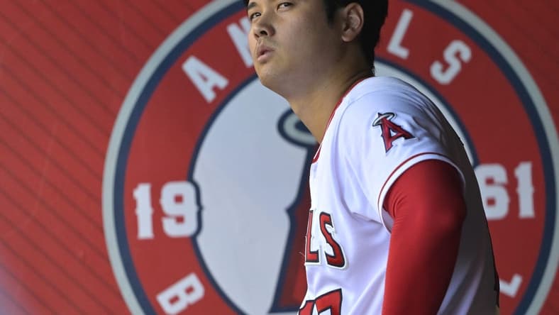 Aug 5, 2023; Anaheim, California, USA; Los Angeles Angels designated hitter Shohei Ohtani (17) looks on from the dugout during the game against the Seattle Mariners at Angel Stadium. Mandatory Credit: Jayne Kamin-Oncea-USA TODAY Sports