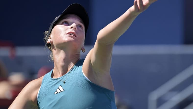 Aug 6, 2023; Montreal, Quebec, Canada; Ashlyn Krueger (USA) serves against Camila Giorgi (ITA) (not pictured) in second round qualifying play at IGA Stadium. Mandatory Credit: Eric Bolte-USA TODAY Sports