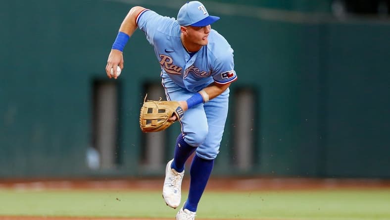 Aug 6, 2023; Arlington, Texas, USA; Texas Rangers third baseman Josh Jung (6) fields a ground ball during the first inning against the Miami Marlins at Globe Life Field. Mandatory Credit: Andrew Dieb-USA TODAY Sports