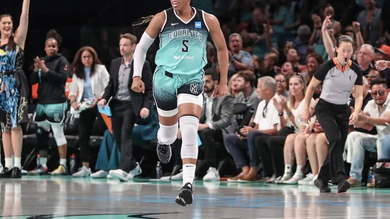 Aug 6, 2023; Brooklyn, New York, USA; New York Liberty forward Kayla Thornton (5) celebrates after making a three point shot in the third quarter against the Las Vegas Aces at Barclays Center. Mandatory Credit: Wendell Cruz-USA TODAY Sports