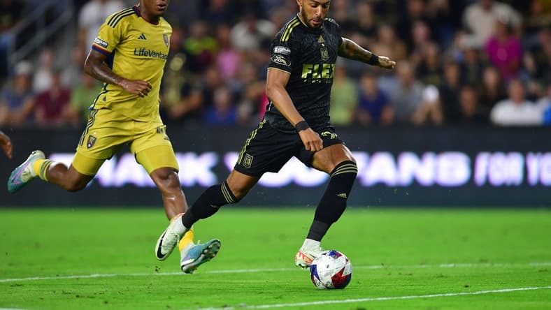 Aug 8, 2023; Los Angeles, CA, USA; Los Angeles FC forward Denis Bouanga (99) scores a goal against Real Salt Lake during the second half at BMO Stadium. Mandatory Credit: Gary A. Vasquez-USA TODAY Sports