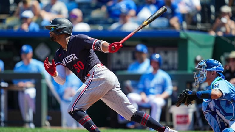 Jul 30, 2023; Kansas City, Missouri, USA; Minnesota Twins left fielder Willi Castro (50) hits a single against the Kansas City Royals during the seventh inning at Kauffman Stadium. Mandatory Credit: Jay Biggerstaff-USA TODAY Sports