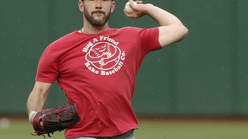 Aug 12, 2023; Pittsburgh, Pennsylvania, USA; Cincinnati Reds relief pitcher Alex Young (48) throws in the outfield before the game against the Pittsburgh Pirates at PNC Park. Mandatory Credit: Charles LeClaire-USA TODAY Sports