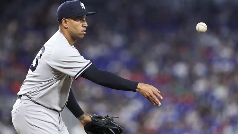 Aug 13, 2023; Miami, Florida, USA; New York Yankees relief pitcher Keynan Middleton (93) tosses the baseball to first base and retires Miami Marlins right fielder Jesus Sanchez (not pictured) during the eighth inning at loanDepot Park. Mandatory Credit: Sam Navarro-USA TODAY Sports
