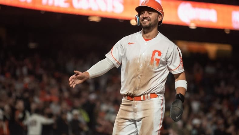 Aug 15, 2023; San Francisco, California, USA; San Francisco Giants right fielder Michael Conforto (8) smiles after scoring during the eighth inning against the Tampa Bay Rays at Oracle Park. Mandatory Credit: Ed Szczepanski-USA TODAY Sports