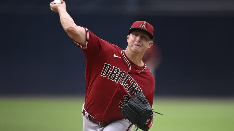 Aug 19, 2023; San Diego, California, USA; Arizona Diamondbacks starting pitcher Scott McGough (30) throws a pitch against the San Diego Padres during the first inning at Petco Park. Mandatory Credit: Orlando Ramirez-USA TODAY Sports
