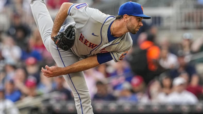 Aug 21, 2023; Cumberland, Georgia, USA; New York Mets starting pitcher David Peterson (23) pitches against the Atlanta Braves during the first inning at Truist Park. Mandatory Credit: Dale Zanine-USA TODAY Sports