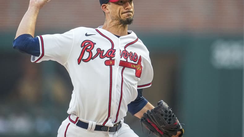 Aug 23, 2023; Cumberland, Georgia, USA; Atlanta Braves starting pitcher Charlie Morton (50) pitches against the New York Mets during the first inning at Truist Park. Mandatory Credit: Dale Zanine-USA TODAY Sports