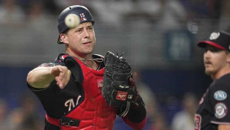 Aug 25, 2023; Miami, Florida, USA; Washington Nationals catcher Riley Adams (15) throws out Miami Marlins right fielder Jesus Sanchez (7) in the ninth inning at loanDepot Park. Mandatory Credit: Jim Rassol-USA TODAY Sports
