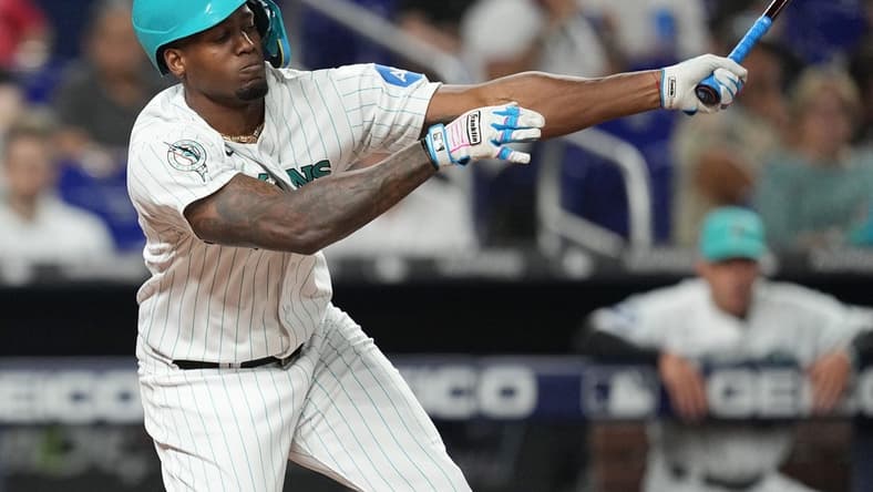 Aug 25, 2023; Miami, Florida, USA; Miami Marlins designated hitter Jorge Soler (12) strikes out in the fourth inning against the Washington Nationals at loanDepot Park. Mandatory Credit: Jim Rassol-USA TODAY Sports