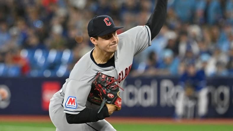 Aug 26, 2023; Toronto, Ontario, CAN; Cleveland Guardians starting pitcher Logan Allen (41) delivers against the Toronto Blue Jays in the first inning at Rogers Centre. Mandatory Credit: Dan Hamilton-USA TODAY Sports