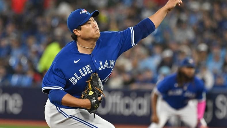 Aug 26, 2023; Toronto, Ontario, CAN;  Toronto Blue Jays starting pitcher Hyun Jin Ryu (99) delivers against the Cleveland Guardians in the first inning at Rogers Centre. Mandatory Credit: Dan Hamilton-USA TODAY Sports